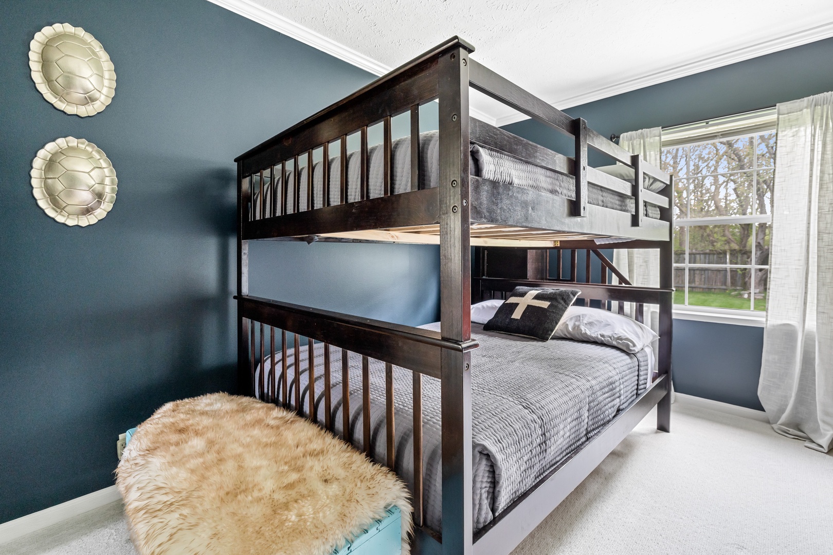 Fun and cozy, this bunk room is perfect for kids and adults alike.