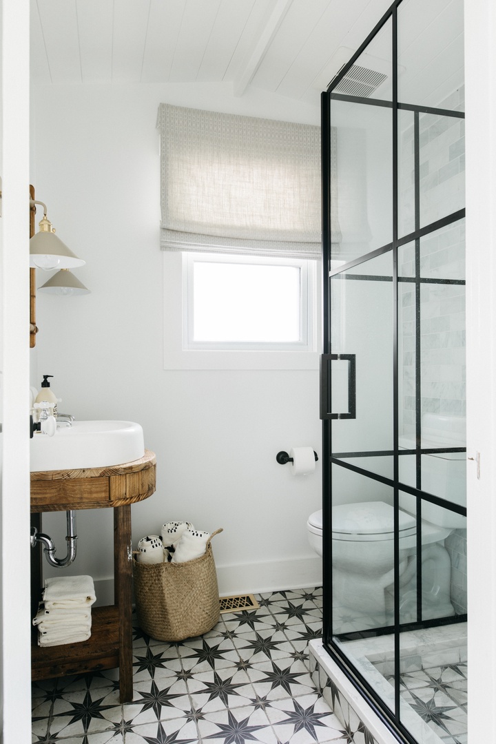 The cottage's second bathroom has a modern walk-in shower.