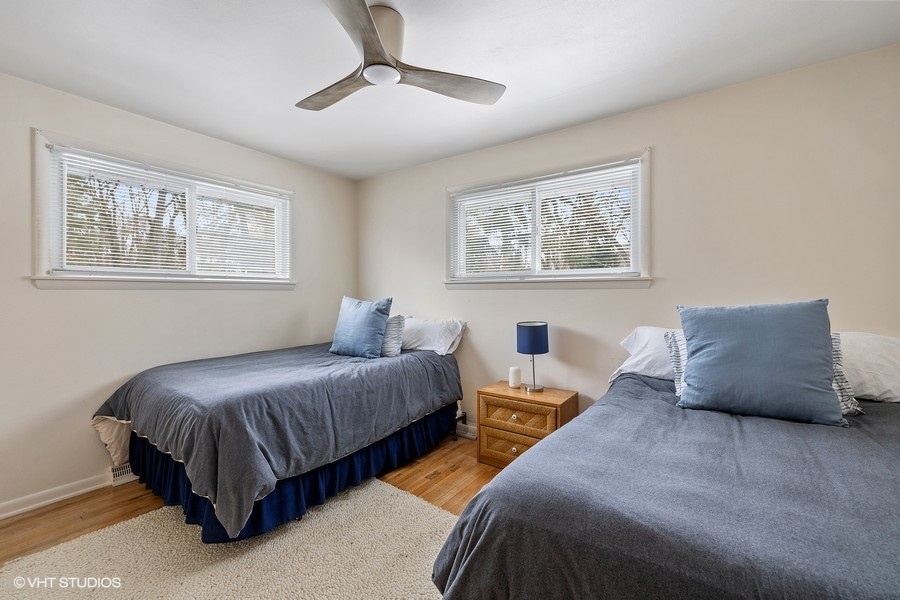 This calming bedroom with twin beds is the perfect spot for anyone to sleep.