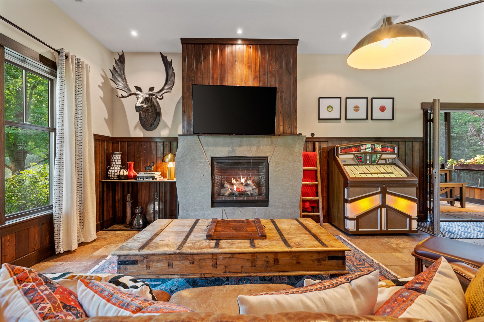 The bluestone fireplace can be enjoyed from both the living and dining room.