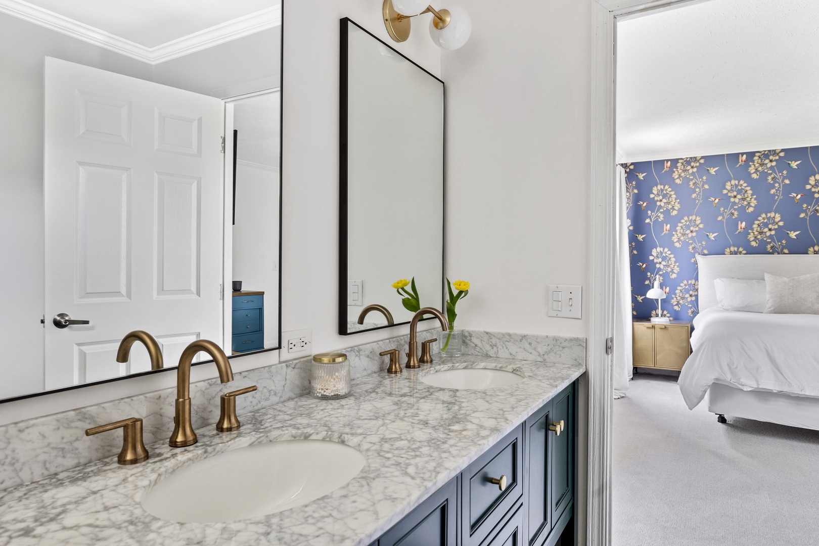The en-suite bathroom offers a relaxing space to unwind after a day of vacation fun.