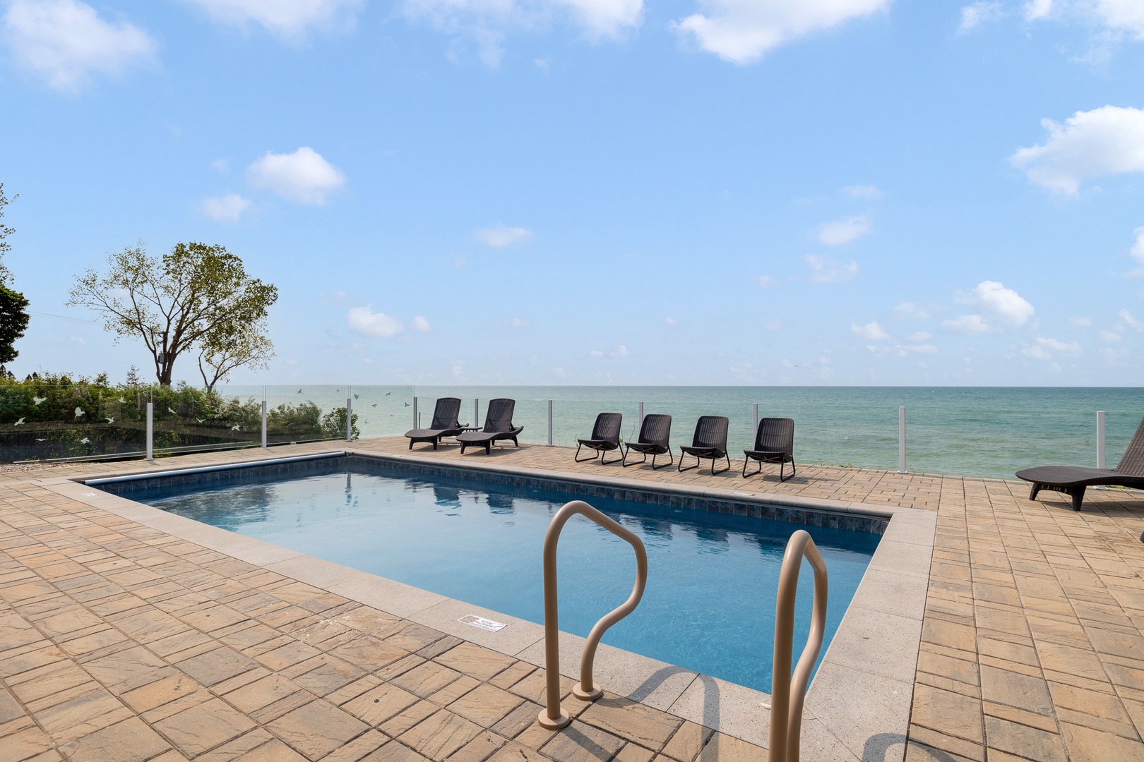 The luxurious pool and amenities make for the ultimate lakefront vacation experience.