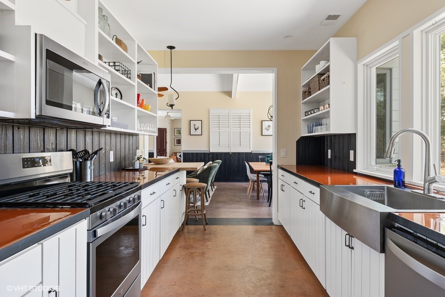 The well-stocked kitchen features a full compliment of high-end appliances.