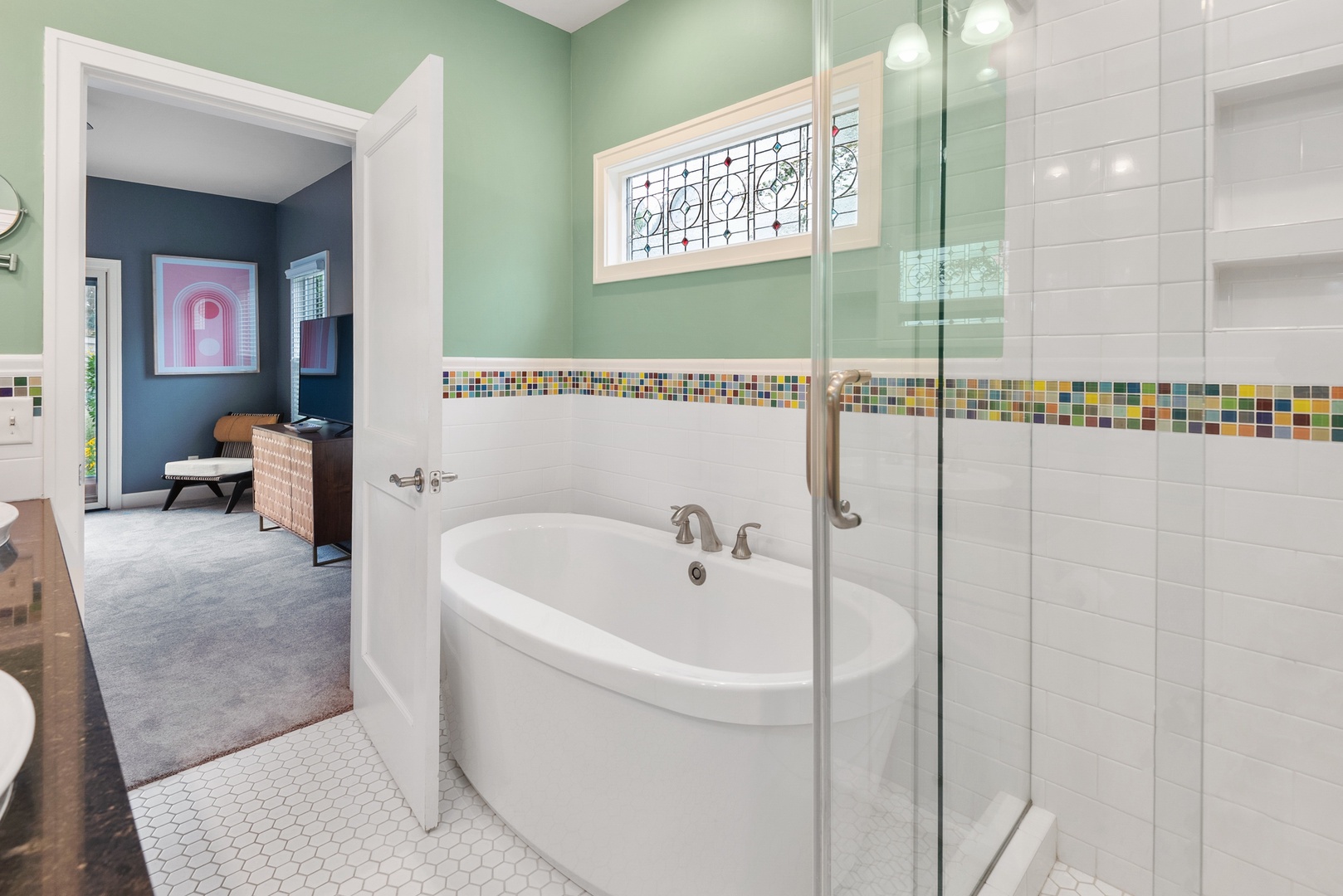 Enjoy a long soak at the end of an adventure-filled day in the main en-suite’s statement tub.
