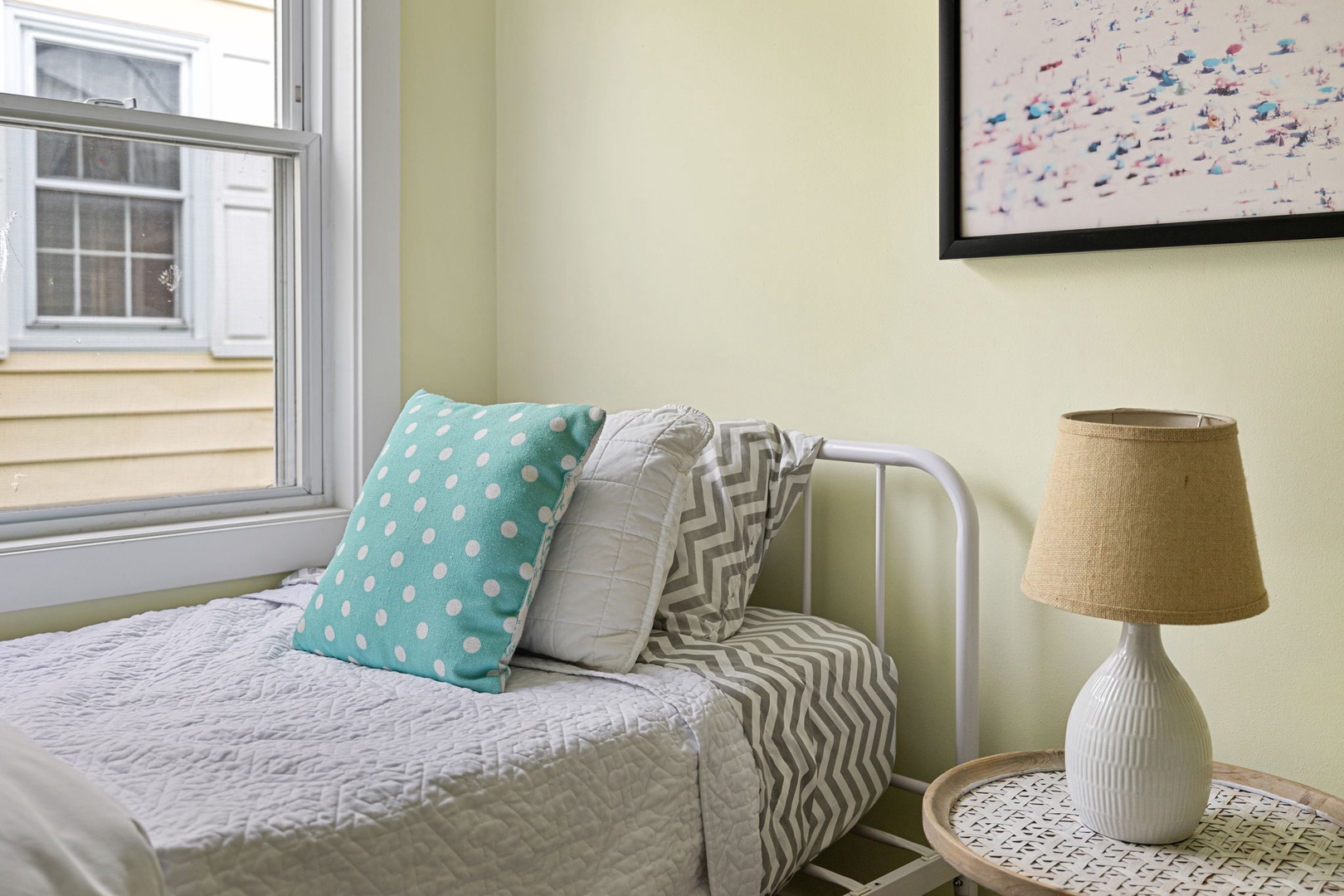 This cozy single bed is part of a super-cute bedroom.