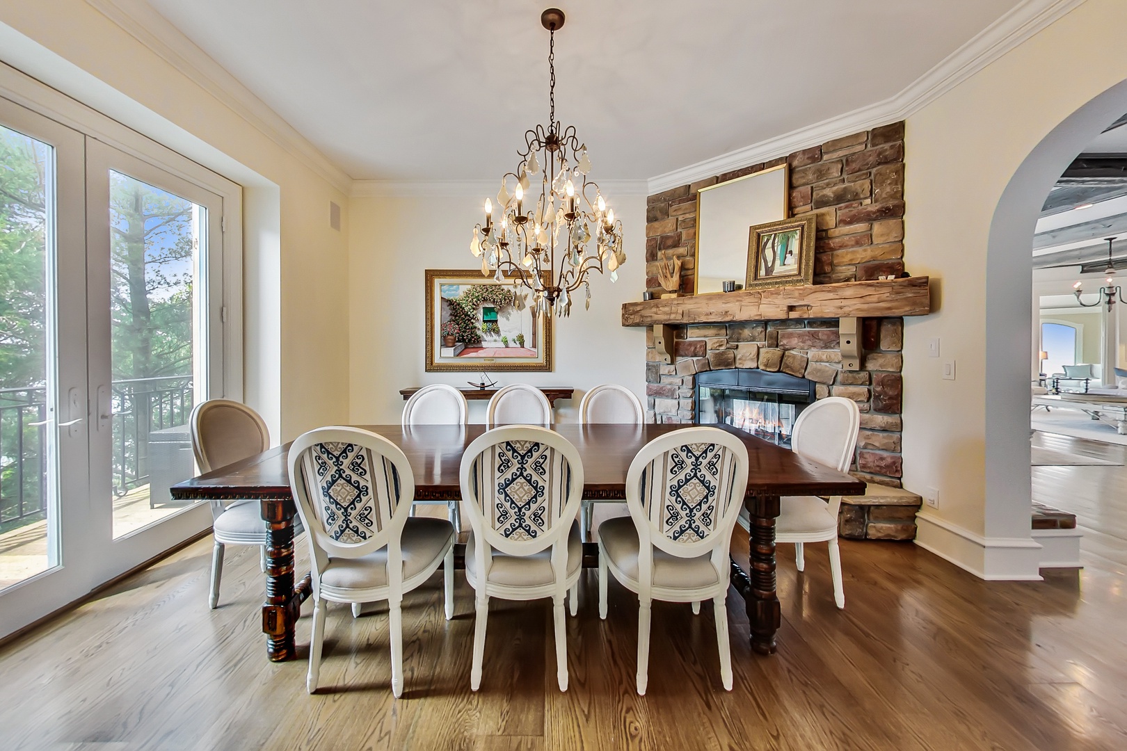 Besides a handsome stone fireplace, this formal dining room has a dazzling view.