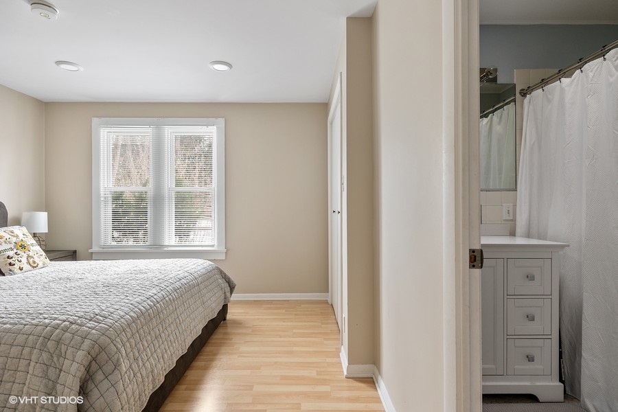 Unwind in the cozy primary bedroom featuring an en-suite bathroom.