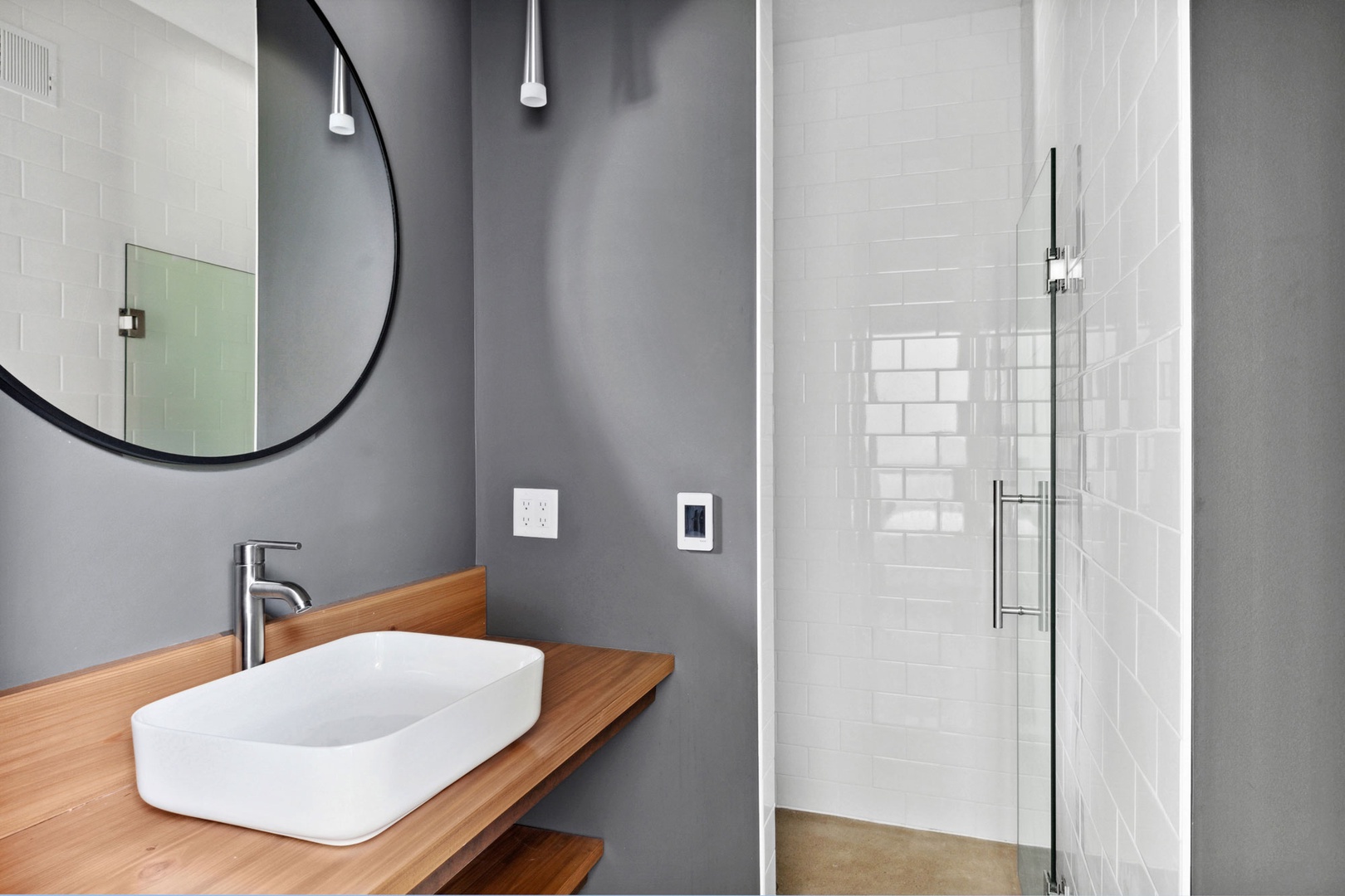 This sleek bathroom provides all the essentials for a hassle-free stay.