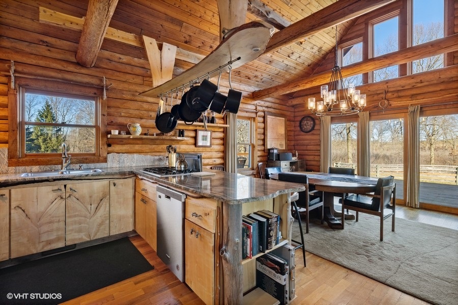 Experience the perfect blend of rustic charm and modern convenience in this spacious kitchen.