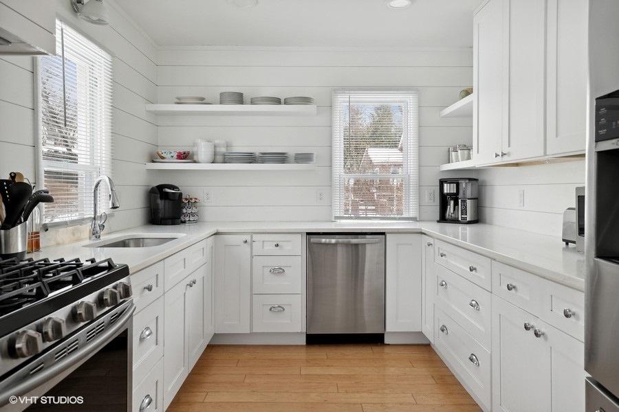 Whip up meals in the modern farmhouse kitchen, equipped with stainless steel appliances and gas stove.
