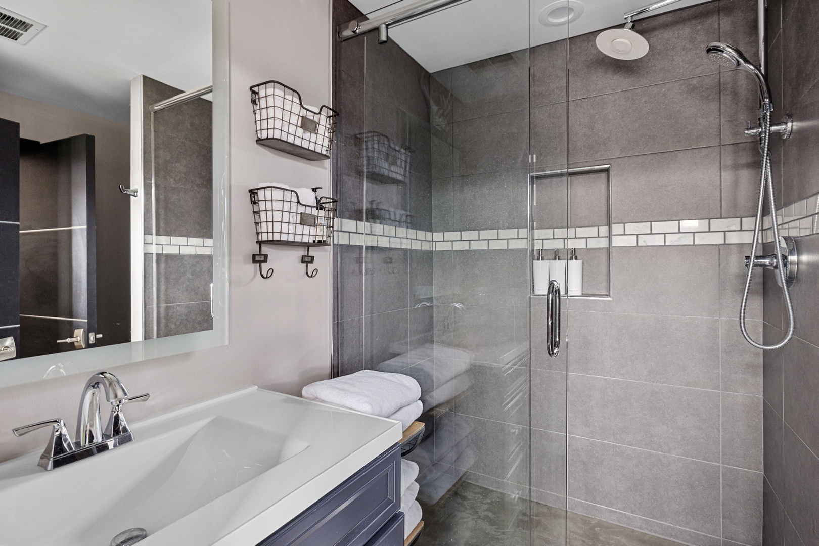 Another gorgeous bathroom with a walk-in tiled shower - plus dual showerheads.