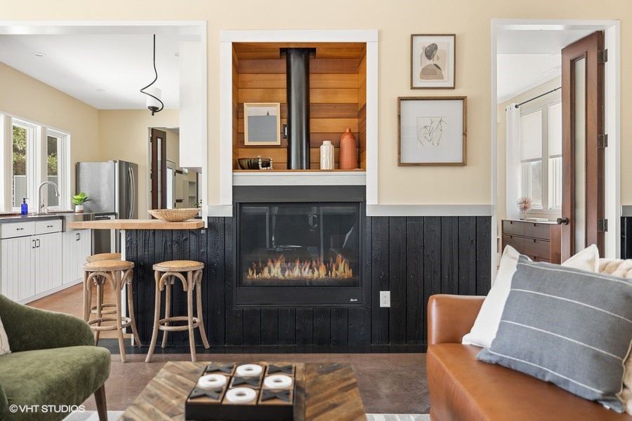 Gather with family and friends by this cozy gas fire place year-round.