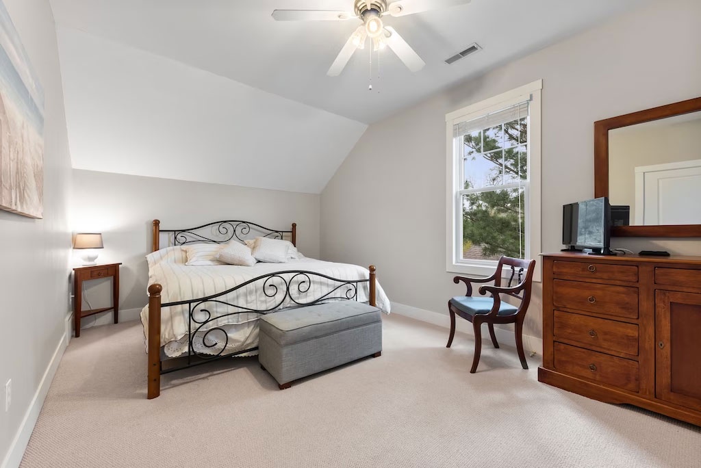 You’ll sleep peacefully in this cozy and serene bedroom.