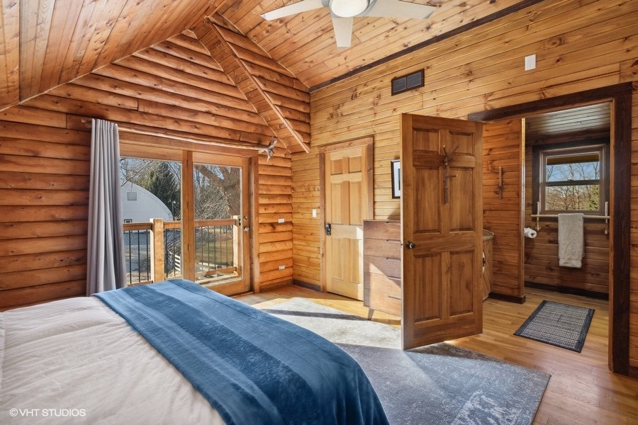 Welcome to the primary bedroom with en-suite bathroom and picturesque views outside.