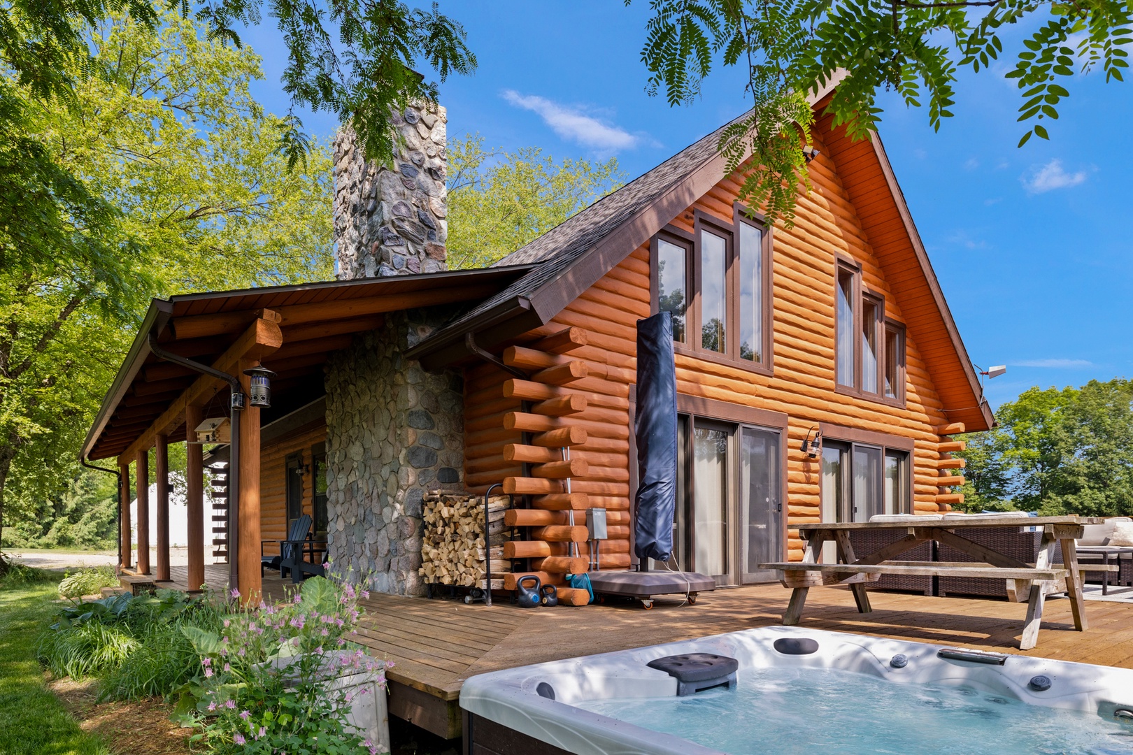 Relax on Scout’s Haven’s outside deck, complete with an in-ground hot tub.