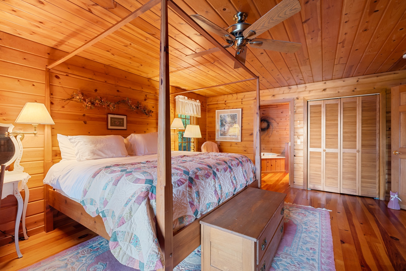 The primary bedroom offers a luxurious escape with its rustic design and ensuite bathroom.