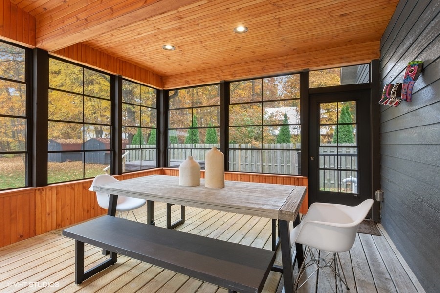Picnic table-style dining on the porch is a great option for the "kids table".