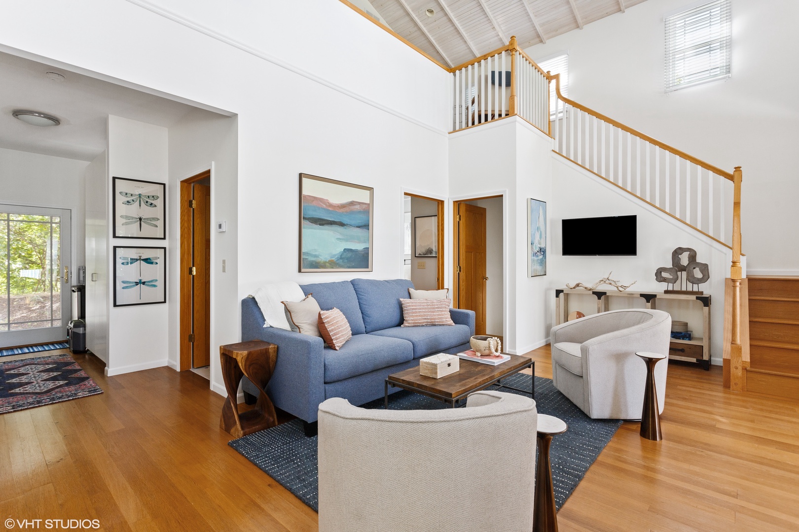 Bright and airy social spaces in this Nantucket-style residence are ideal for family gatherings.