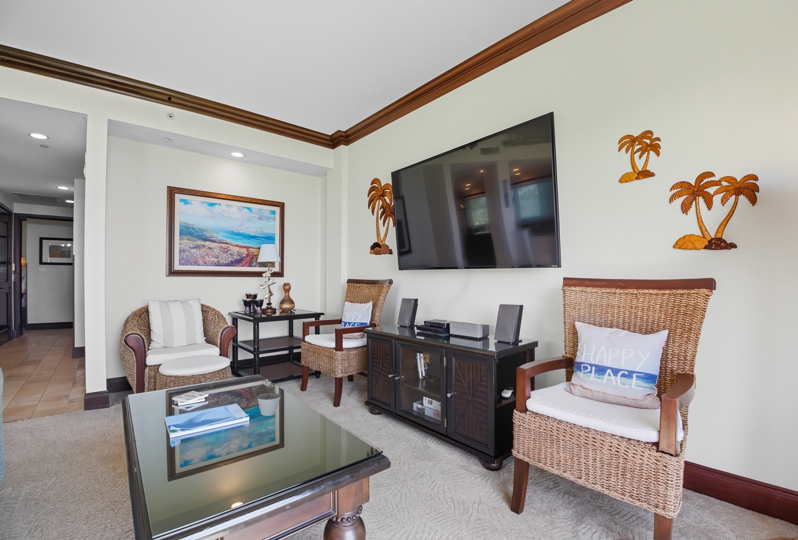 Relax in style – This inviting living space is beautifully decorated with tropical touches and designed for total comfort after a day in the sun