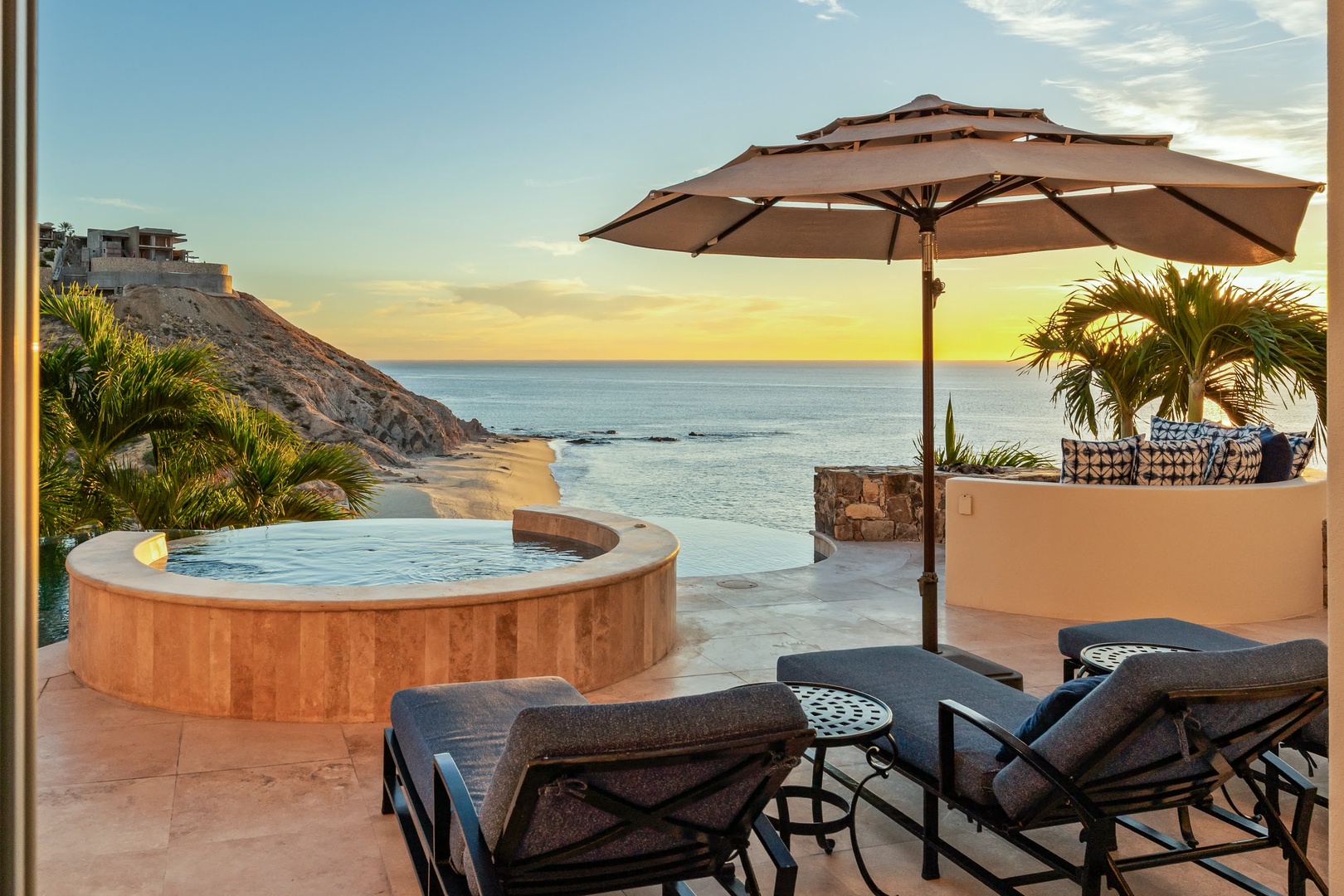Unwind in your private hot tub while golden sunset hues paint the ocean horizon, creating the perfect backdrop for ultimate relaxation.