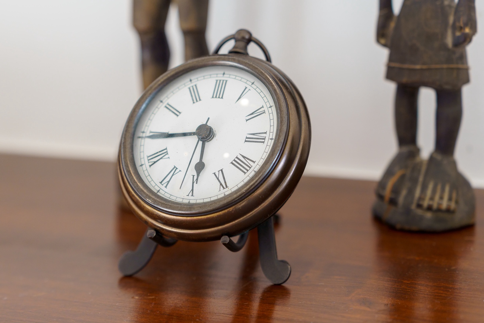 Charming vintage clock adds timeless elegance to your bedside table, creating a cozy atmosphere for peaceful mornings.