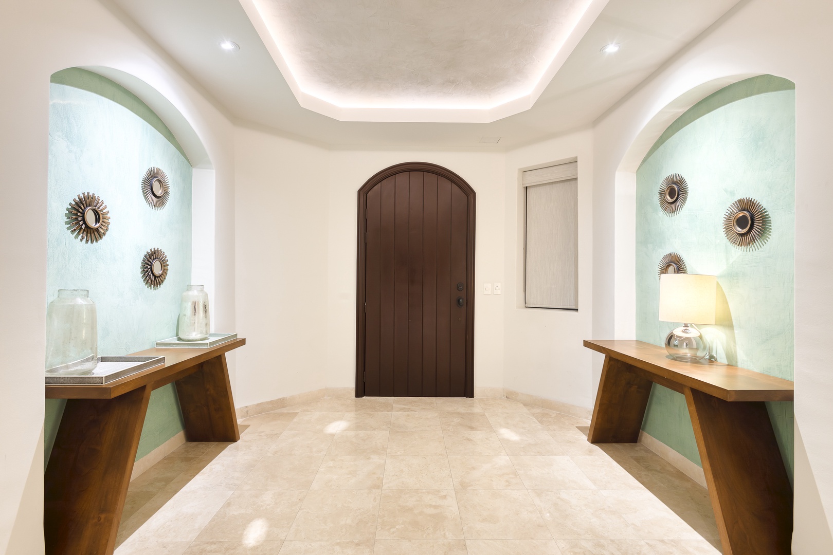 An elegant entryway sets the tone for your stay with arched alcoves, warm lighting, and coastal-inspired décor that welcomes you home the moment you arrive.