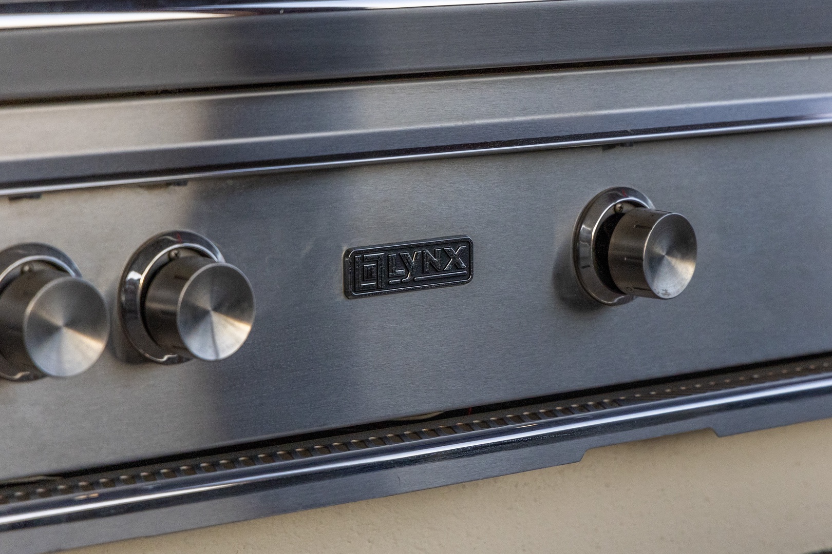 A professional built-in gas stove with sleek metallic controls ready for you to create delicious home-cooked meals during your stay.