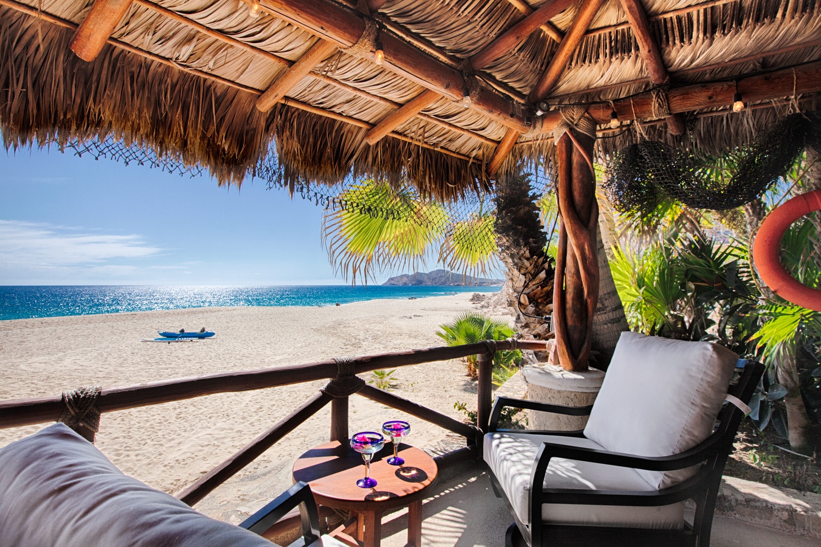Sip your morning coffee under this thatched palapa while pristine beach and turquoise waves stretch endlessly before you.