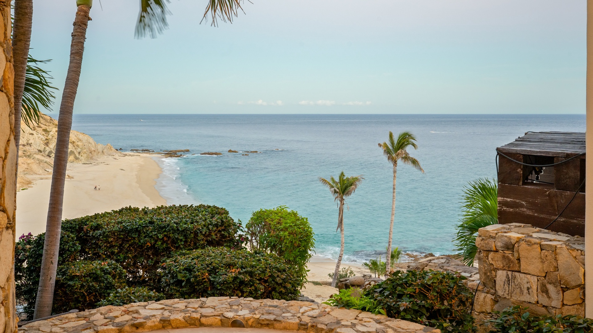 Pristine beach with turquoise waters and swaying palms creates the perfect tropical backdrop for your oceanfront getaway.