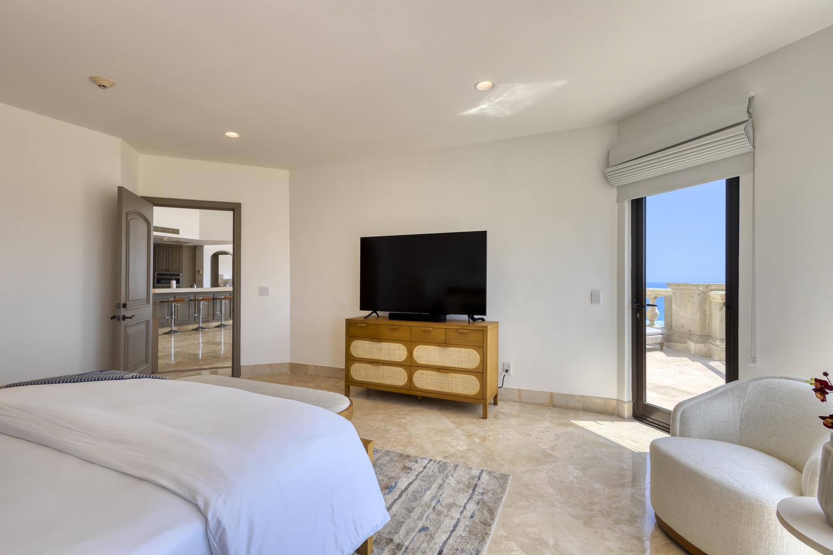 Sink into crisp linens and wake to brilliant sea views. Your private balcony and modern amenities create a serene retreat after sun-soaked days.