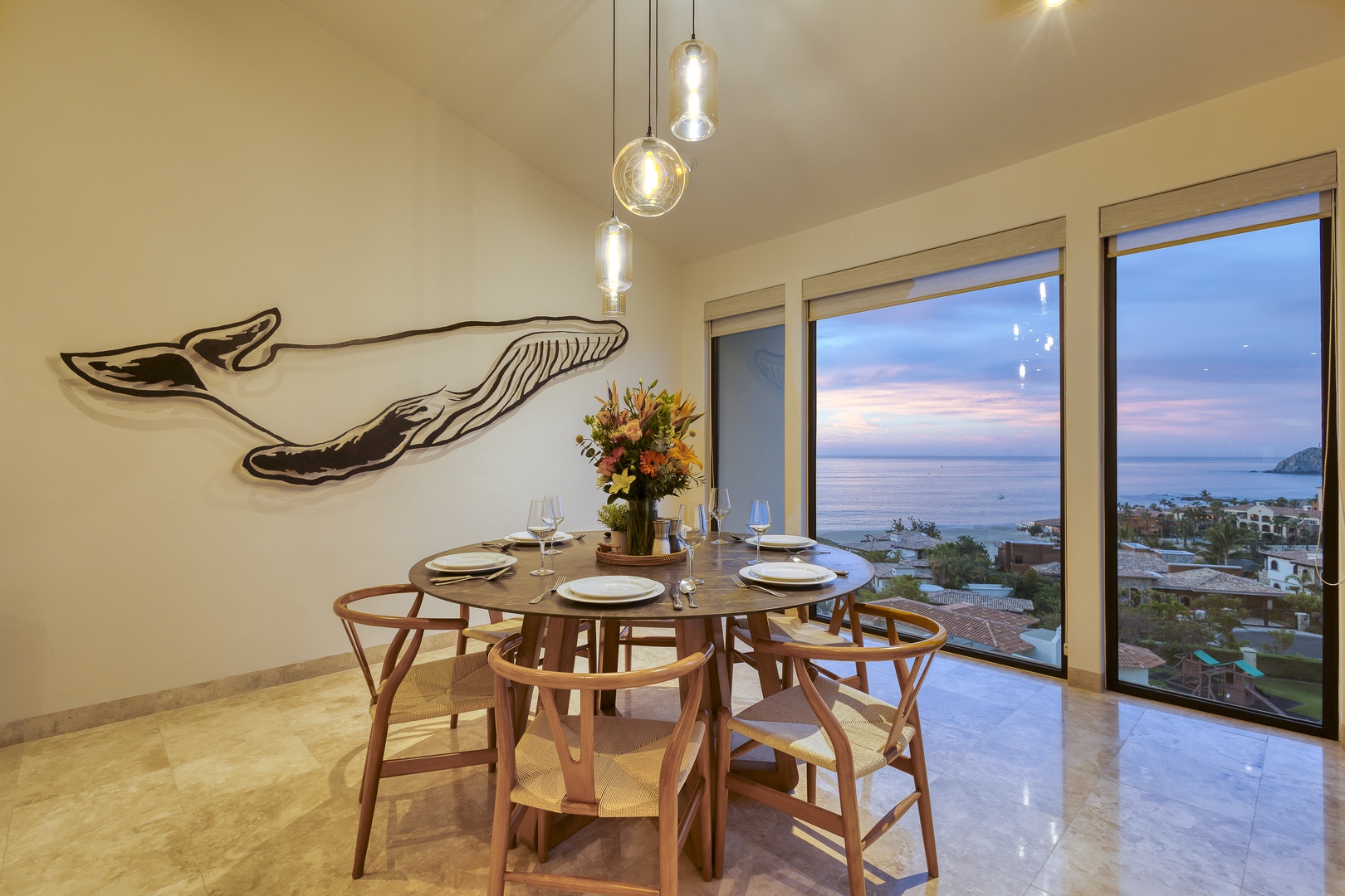 Picture yourself dining with stunning ocean views at sunset, where coastal beauty and elegant design create unforgettable moments at your table.