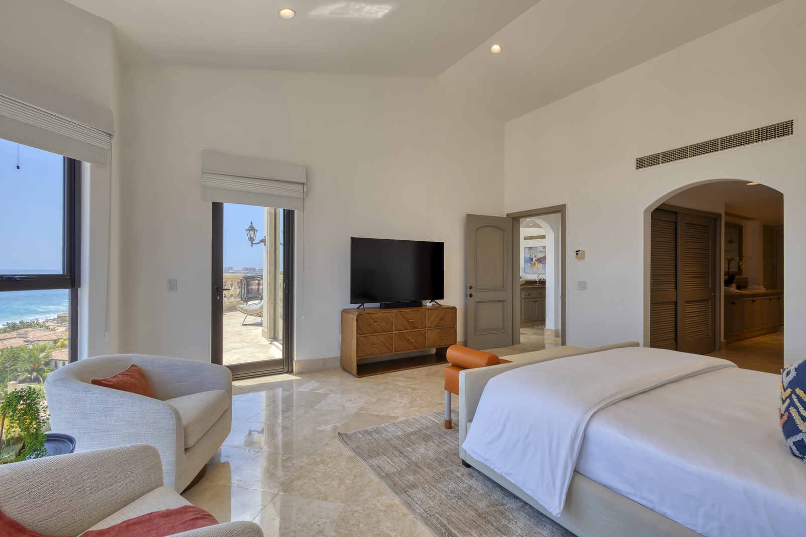 Wake up to stunning sea views from your king-size bed. This airy suite blends modern comfort with coastal elegance—your perfect retreat awaits.