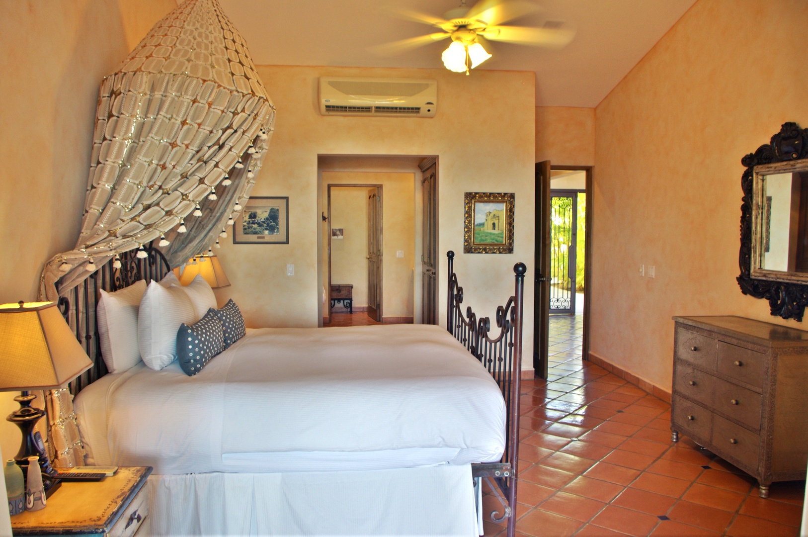 Step into your tranquil retreat—plush linens, handcrafted accents, and warm terracotta floors set a relaxing, romantic tone with air conditioning ensuring your cool comfort throughout your stay.