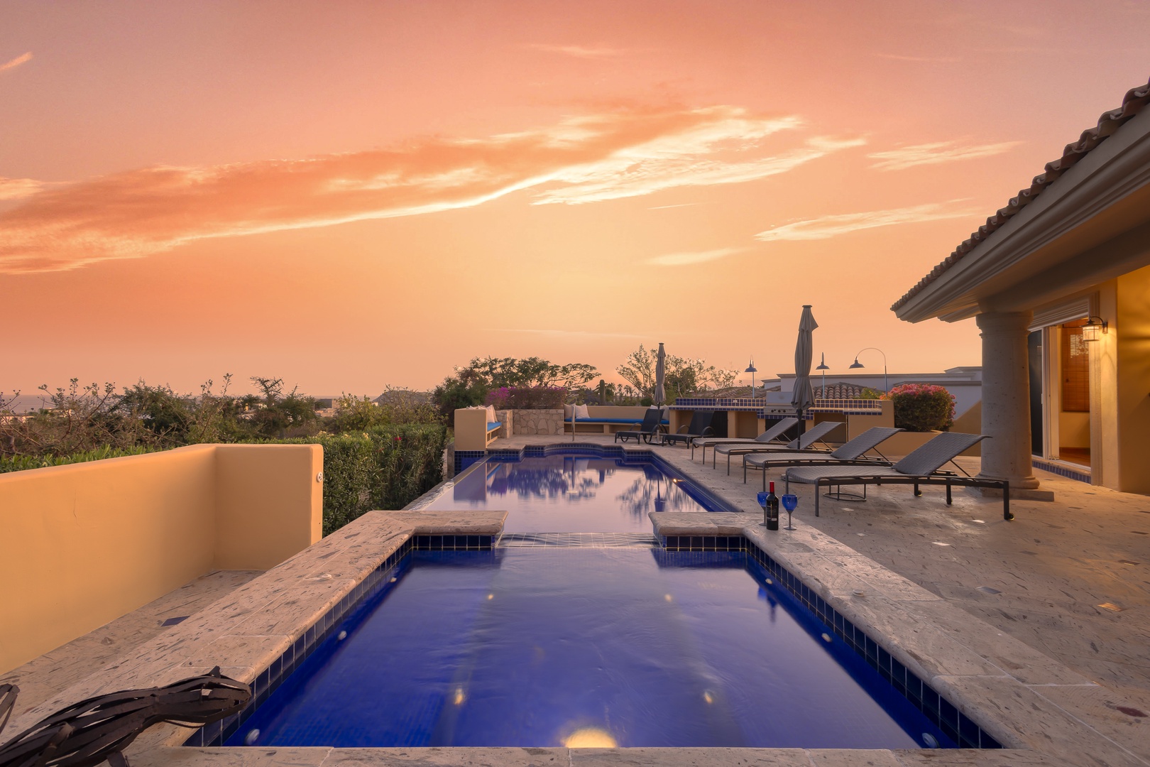 Dive into your private infinity pool as golden sunset paints the sky, creating the perfect evening retreat.