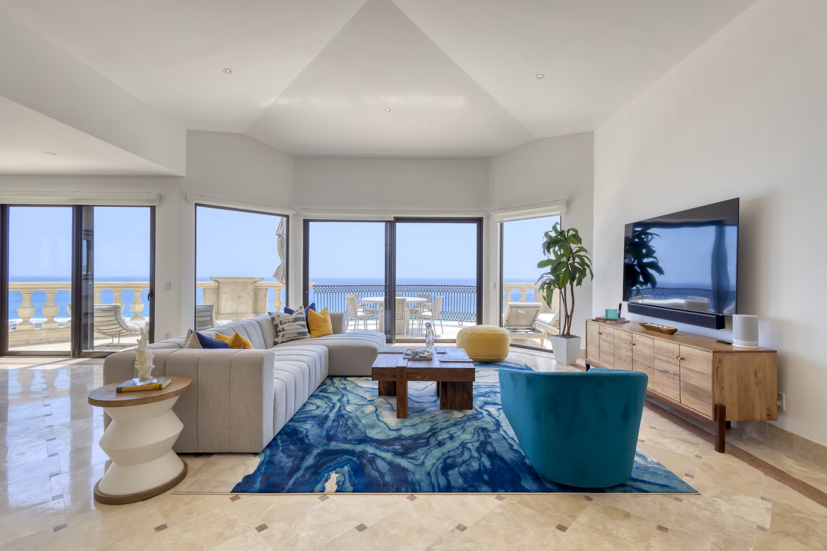 Relax in this bright, open living space with stunning sea views, stylish coastal decor, and direct access to your private balcony overlooking the ocean.