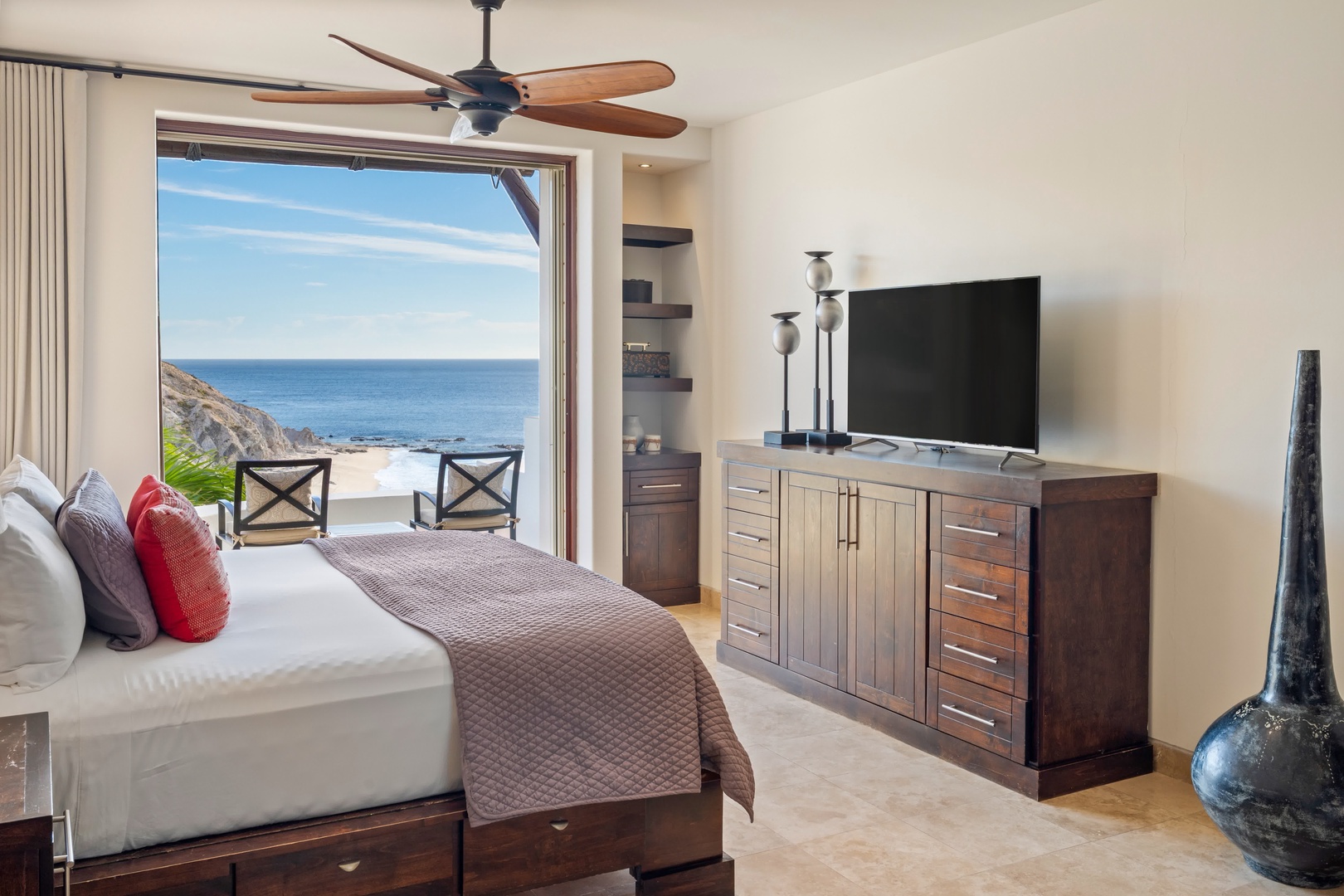 Wake up to breathtaking ocean views from your bed, where modern comfort meets coastal luxury in this serene retreat.