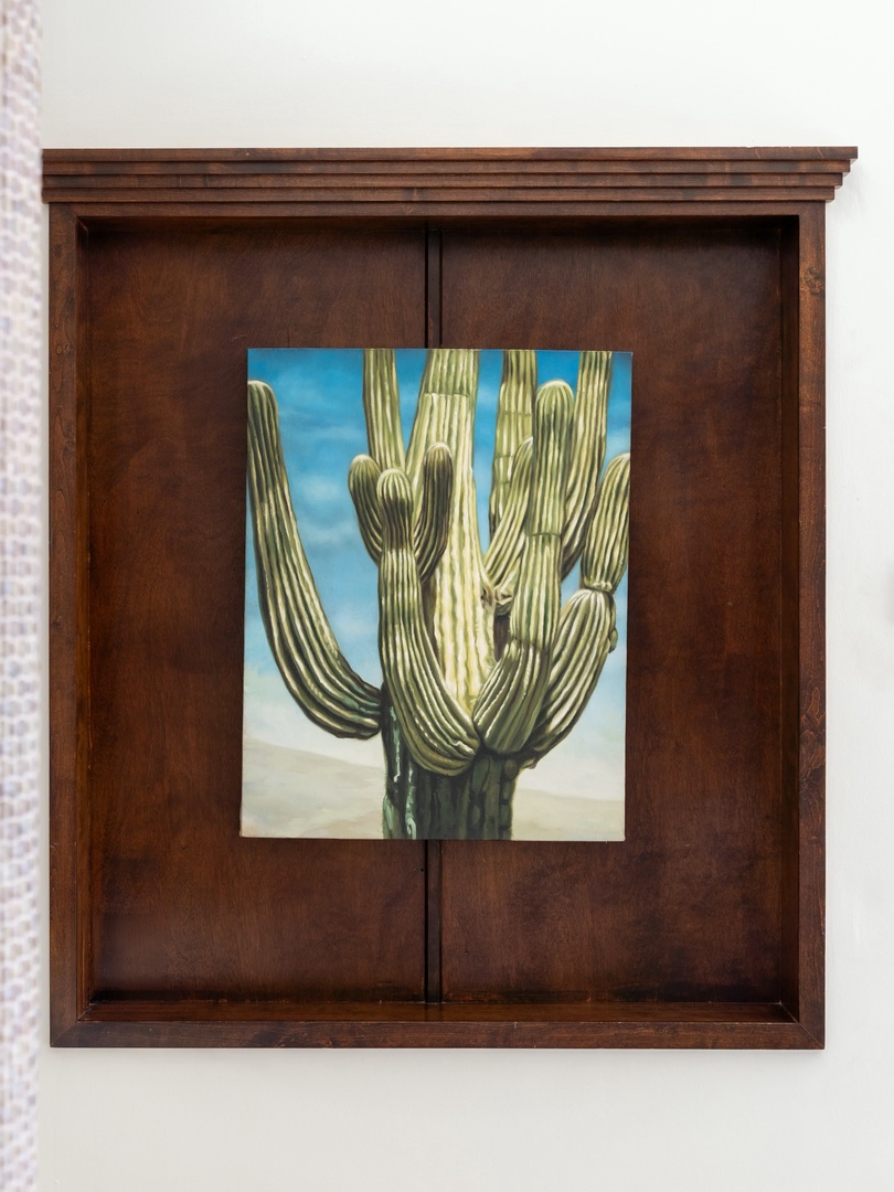 Your room features beautiful southwestern artwork in a rich wooden display case, bringing desert charm to your space.