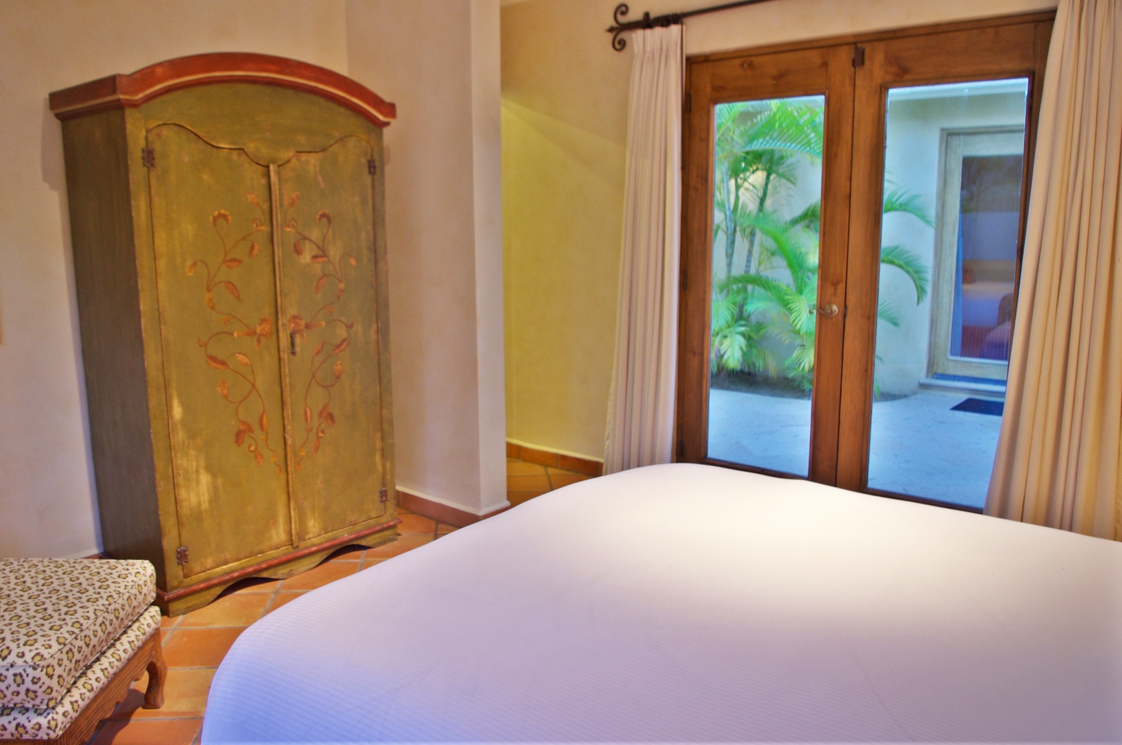 Drift off in crisp linens with tropical breezes and lush palm views just beyond your private terrace doors, while charming hand-painted furnishings add character to your peaceful retreat.