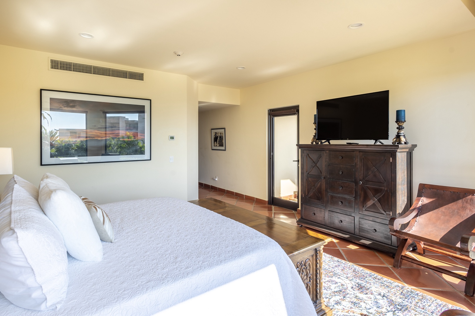 Sink into plush bedding while enjoying your private TV and warming fireplace in this elegant bedroom retreat.