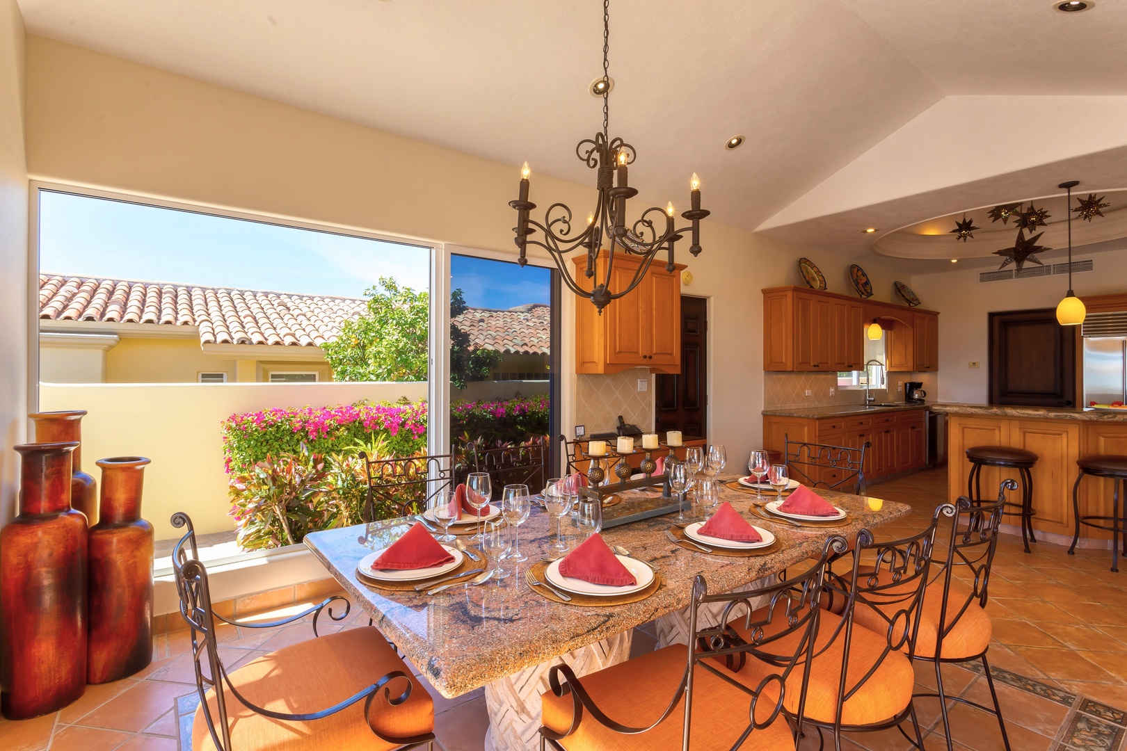 Gather around this stunning granite dining table where memories are made over shared meals, with your gourmet kitchen just steps away.