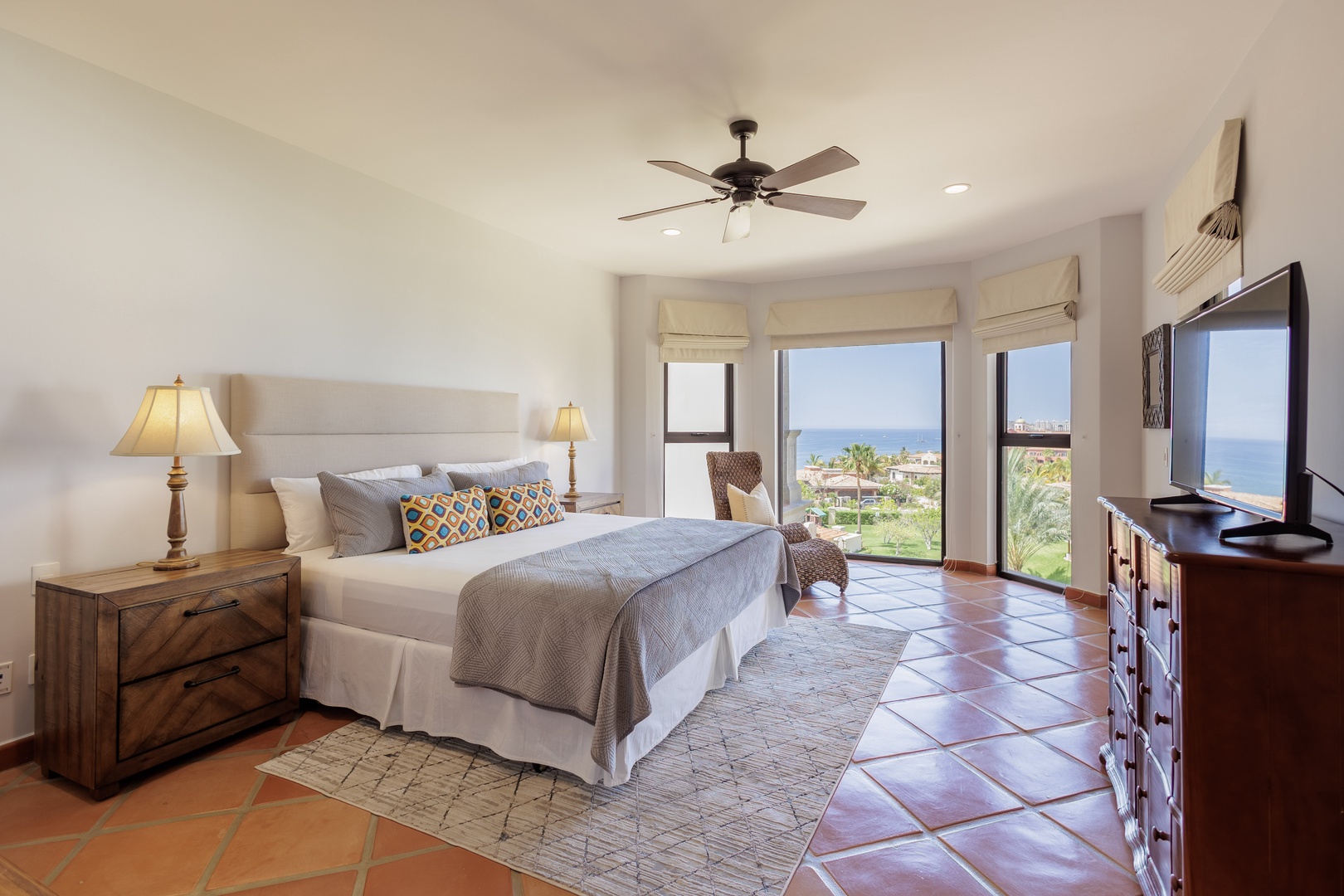 Wake up to stunning ocean views stretching across the horizon from your private bedroom retreat, where natural light and coastal breezes create your perfect seaside escape.