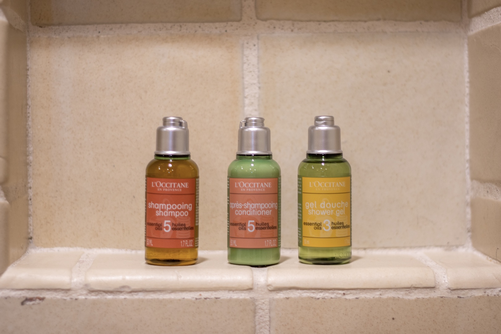 Thoughtfully curated L'Occitane toiletries await you in the shower, featuring premium shampoo, conditioner, and shower gel with essential oils for a spa-like start to your day.