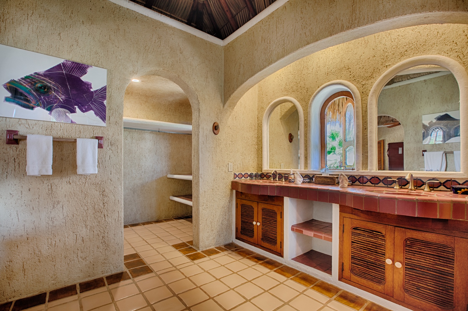 Step into your luxurious bathroom sanctuary, where warm earth tones and elegant archways create a spa-like retreat for your morning routine.