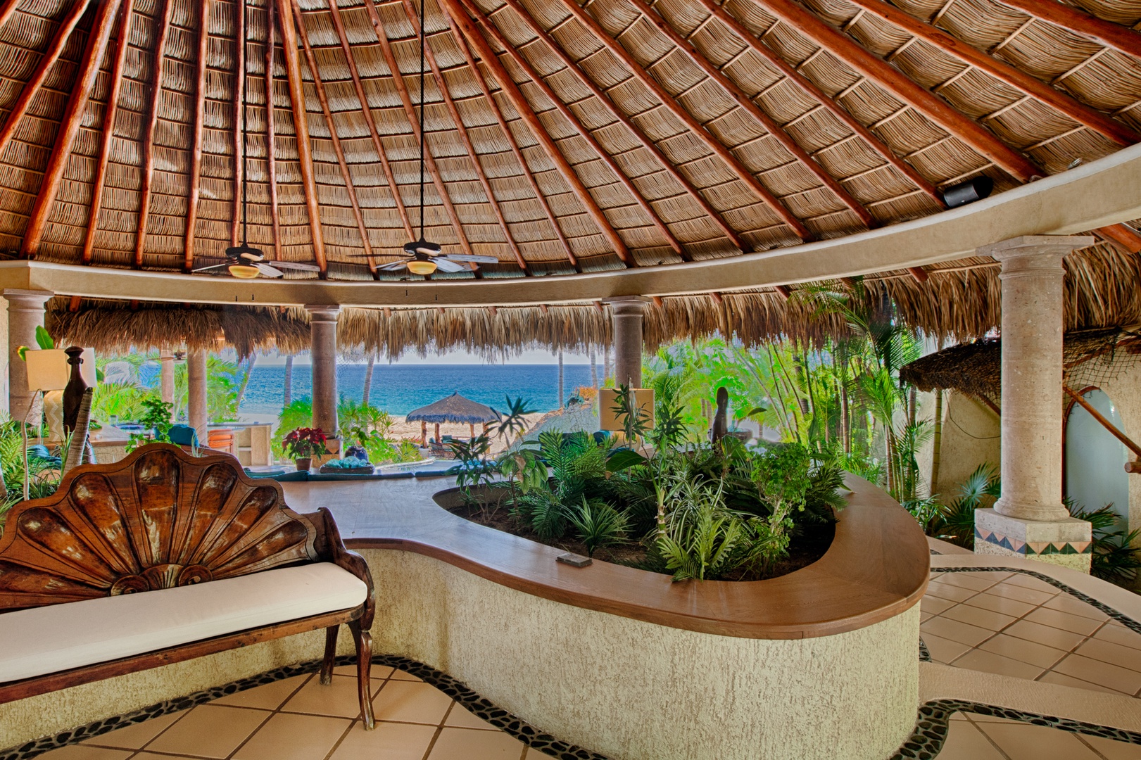Relax under your private palapa with stunning ocean views and tropical gardens creating your perfect beachfront sanctuary.