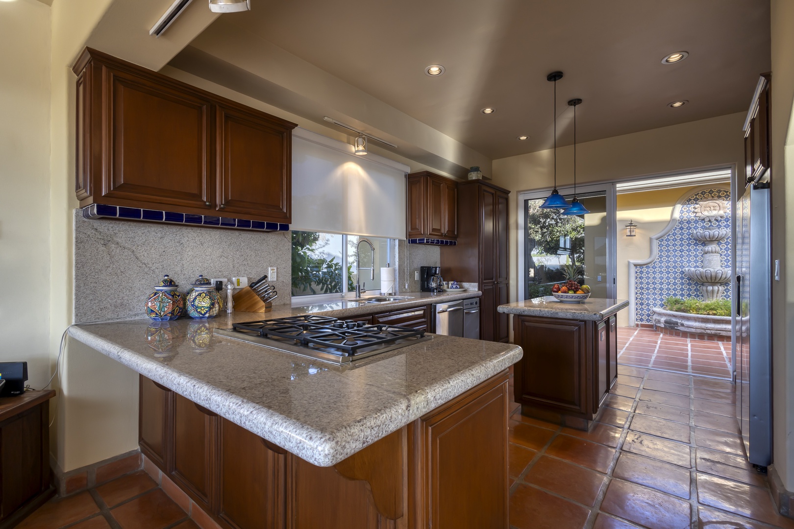 Your gourmet kitchen awaits with granite countertops, gas range, and rich wood cabinetry for creating memorable meals together.