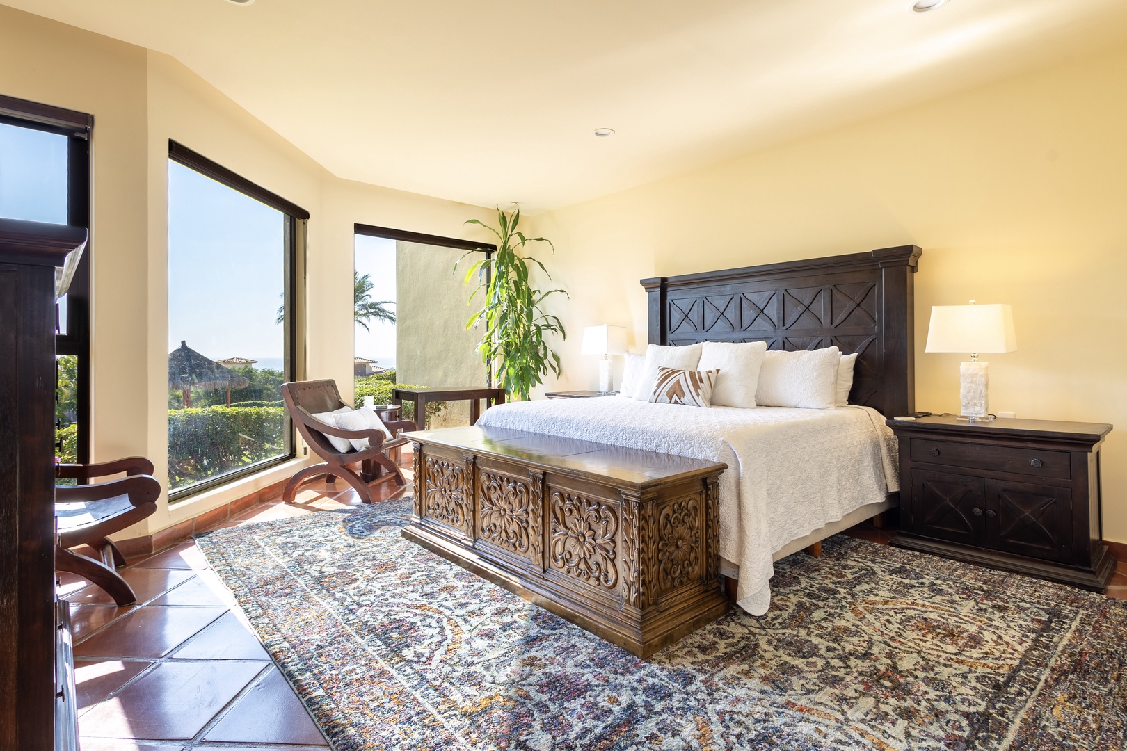 Drift off in your serene master bedroom, where carved wood furniture and soft linens create the perfect sanctuary for rest.