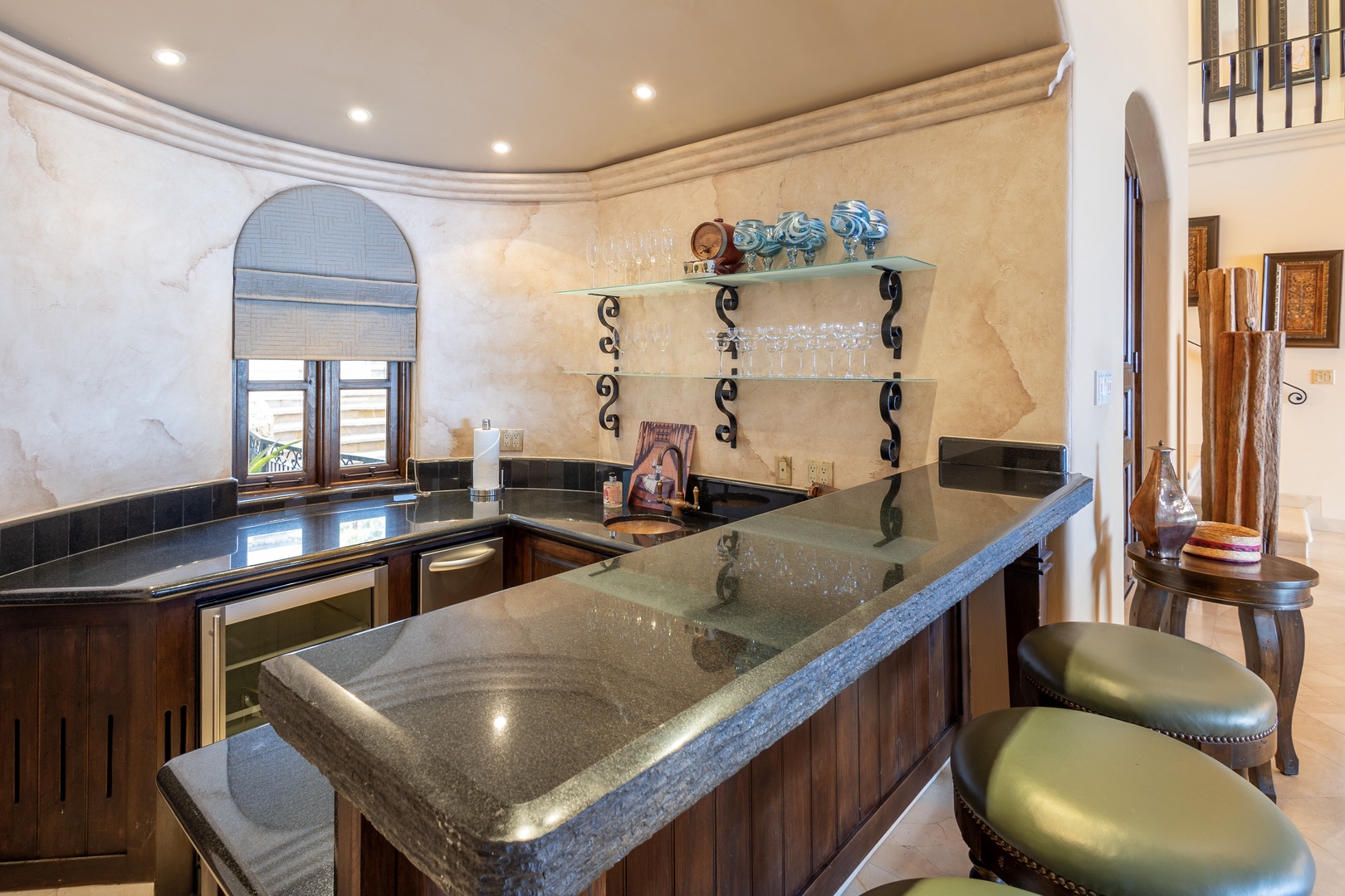 Your fully equipped kitchen welcomes you with granite countertops, custom cabinetry, and an elegant breakfast bar—perfect for preparing meals or enjoying morning coffee in style.