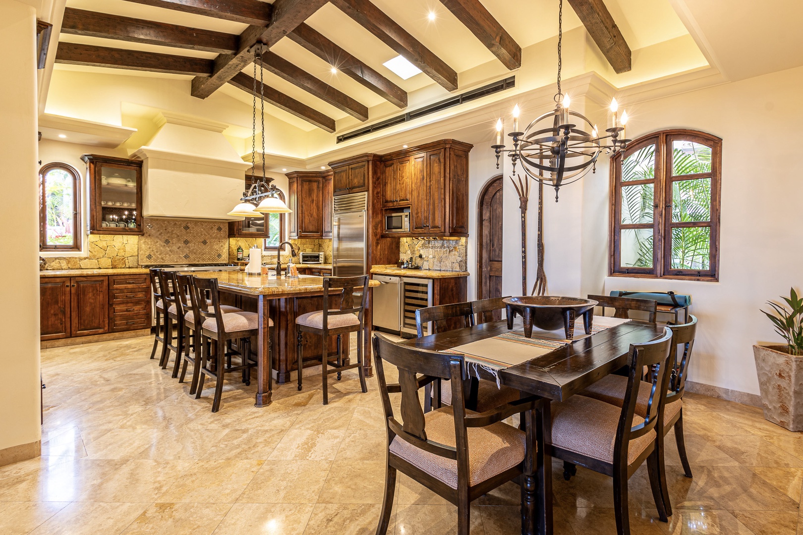 This stunning open-concept space brings together gourmet cooking and memorable meals. Warm wood beams and refined cabinetry set the stage for your perfect vacation gatherings.