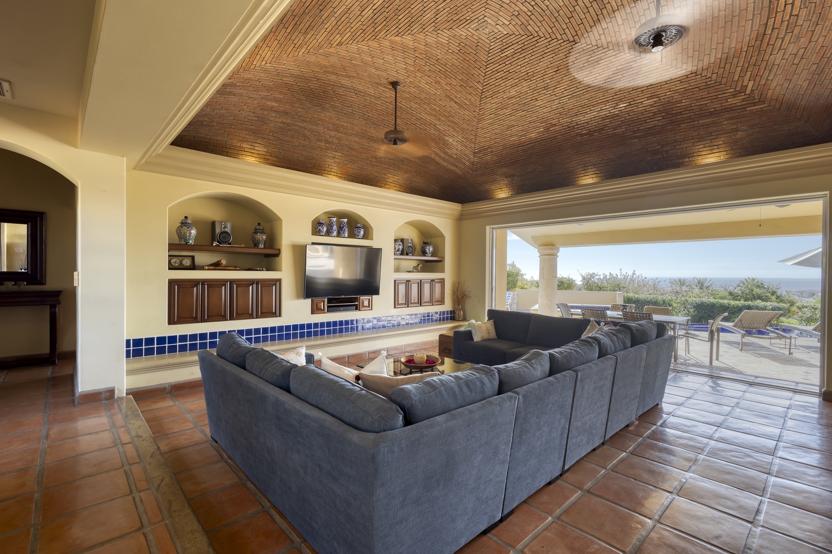Relax in your spacious living room with stunning bamboo ceilings and sweeping views of the landscape beyond your private terrace.
