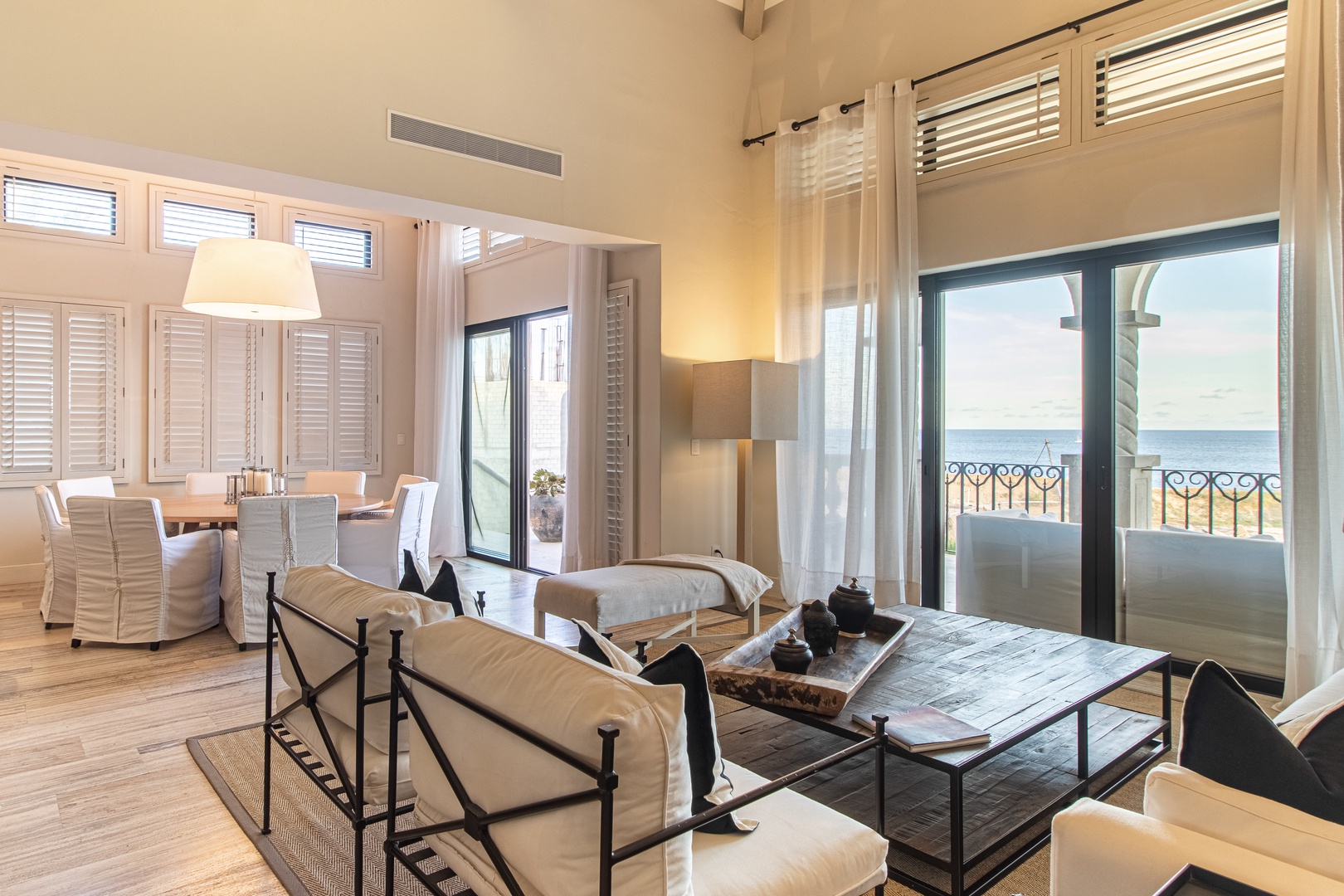 Picture yourself unwinding in this airy coastal retreat, where natural light floods the open-plan living and dining space. French doors open to your private balcony overlooking the sparkling ocean—your perfect escape.